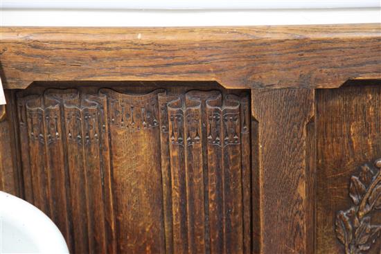 An Edwardian carved oak bench seat, formerly from Christs Hospital, Sussex, W.7ft